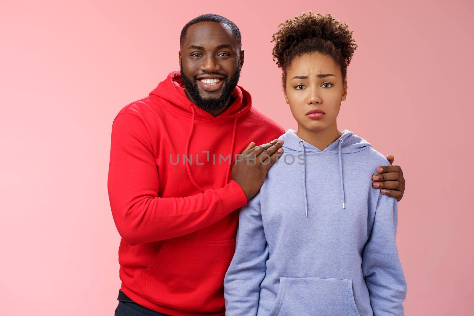 Girl unwilling participate event feel nervous insecure boyfriend encouraging hugging boost confidense assuring everything alright smiling self-assured promise everything be okay, pink background by Benzoix