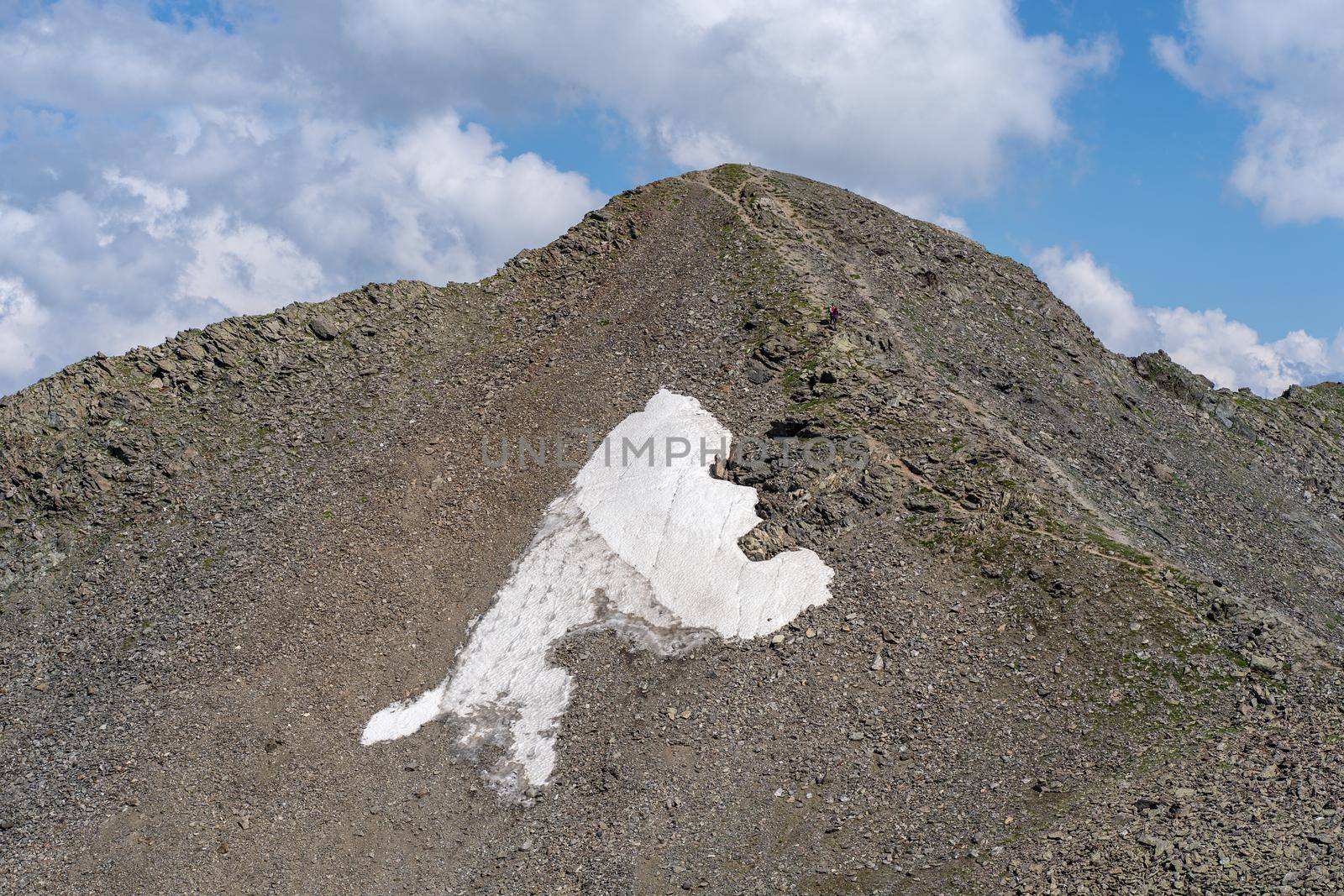 The rocky mountains were shrouded in clouds on a Sunny day. Stunning mountain views by epidemiks