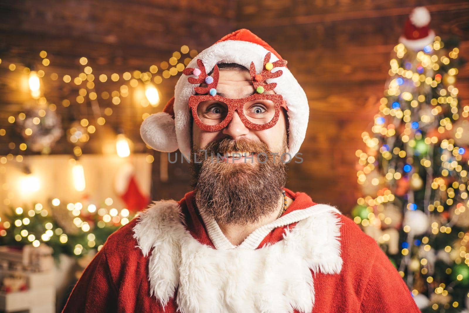 Crazy Hipster Santa. Handsome man wearing in Christmas dress. Holly jolly swag Christmas and noel. Funny Santa