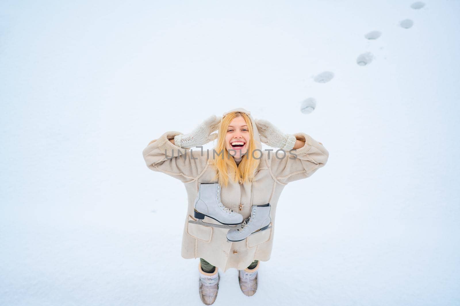 Enjoying nature wintertime. Winter landscape background. Funny young woman in the winter time. Love winter. Beautiful woman walking in winter park and feeling wonderful