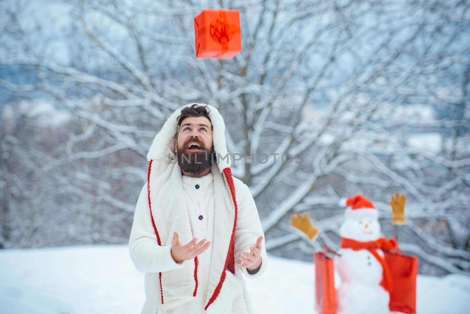 Enjoying nature wintertime. Santa Claus wishes Merry Christmas. Man is happy about the new year. Funny winter people Portrait