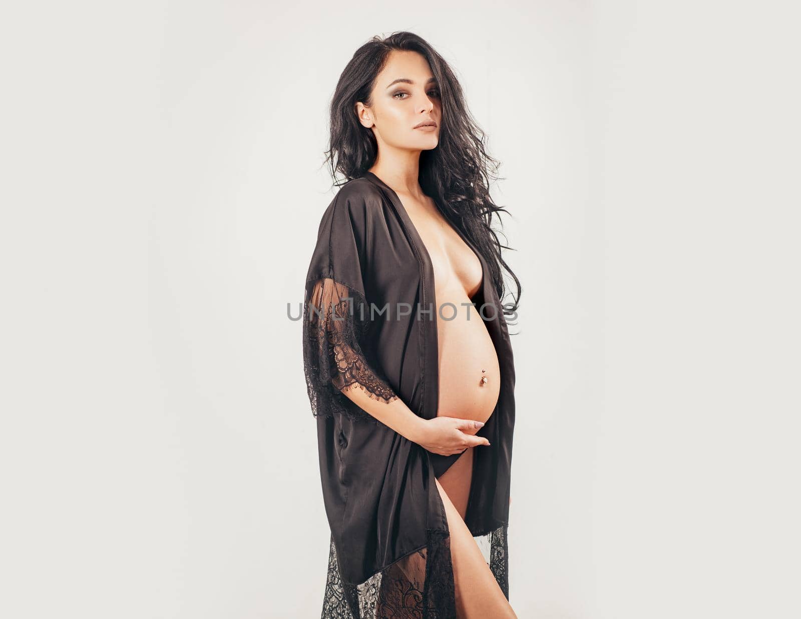 Maternity preparation. future mother have baby inside. womens health. girl with big belly. life birth expectation. beautiful pregnant woman in silk underwear. pregnancy. She is going to be a mom soon.