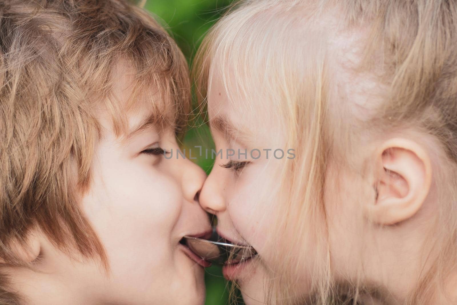 Portrait Close up of two children friends. Happy brother and sister. Fool around. by Tverdokhlib