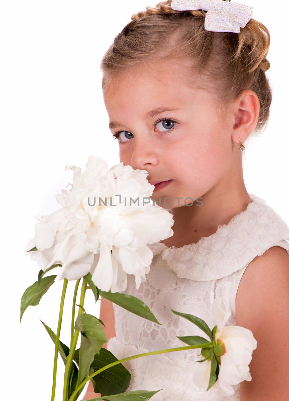 Happy little girl giving peony flowers on white background by aprilphoto