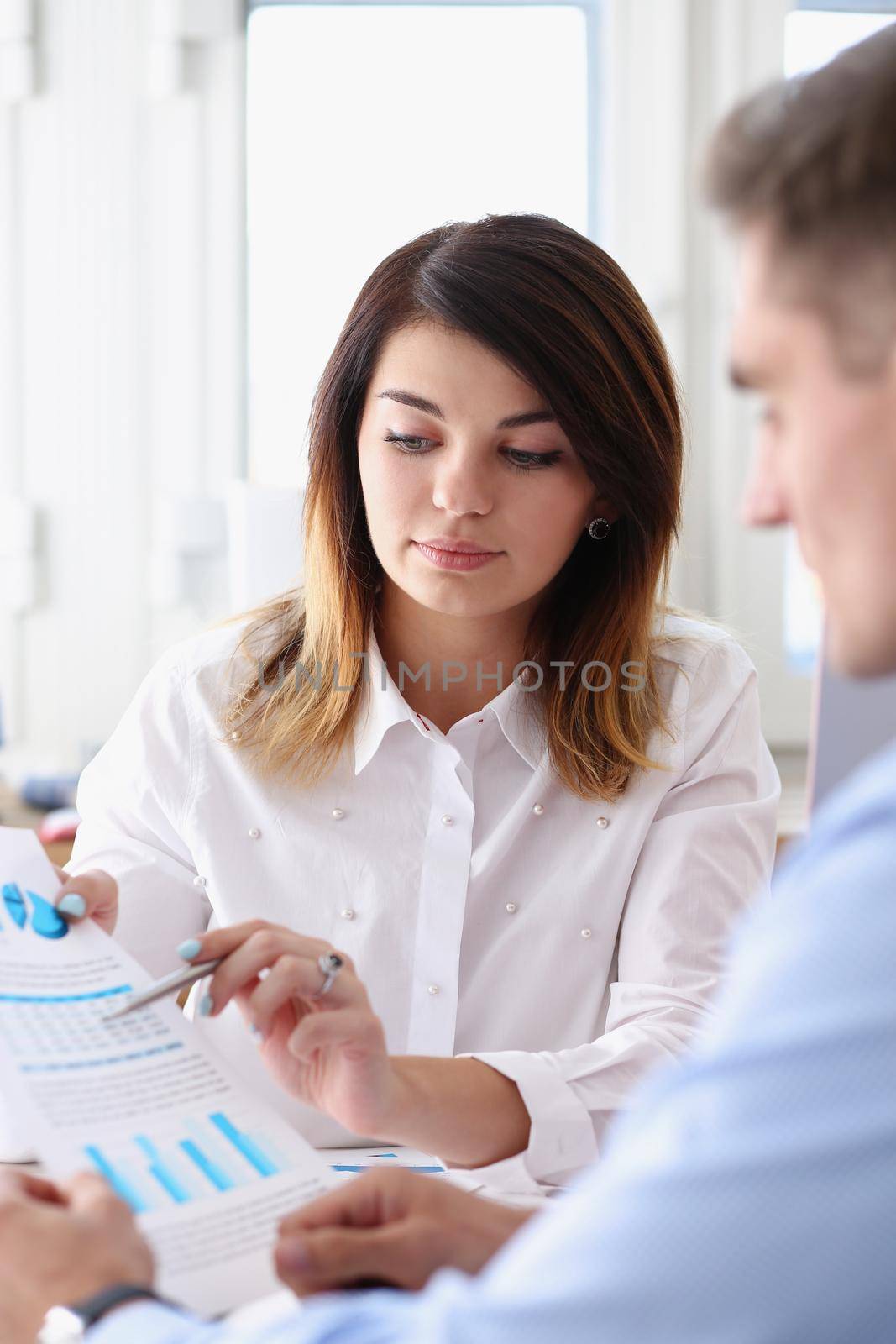 Group of people deliberate on problem with paper infographics hold in hand closeup. White collar check money papers stock exchange market earnings list partnership agreement discussion concept