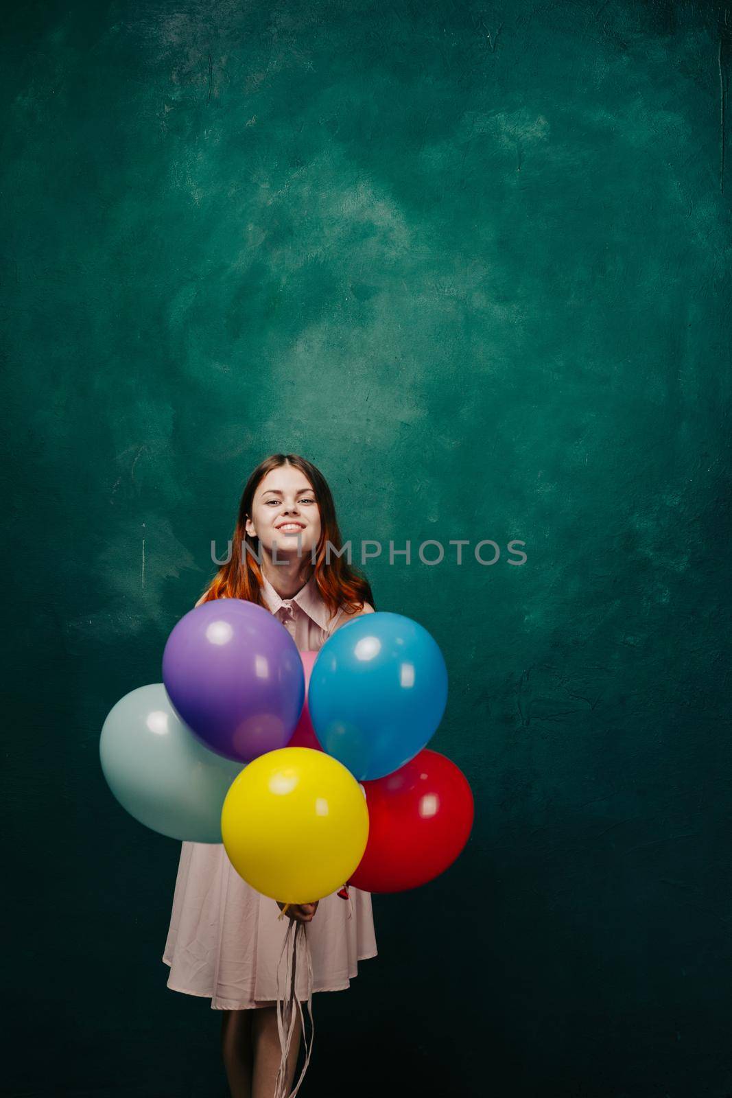 cheerful woman with colorful balloons birthday fun by Vichizh