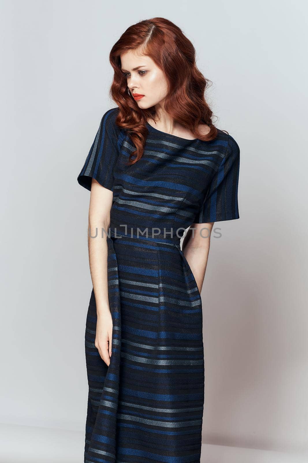 red-haired woman fun dresses posing lifestyle. High quality photo