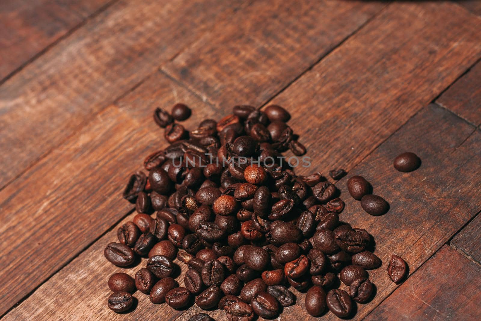 a cup of coffee Hot drink spilled grains wooden table. High quality photo