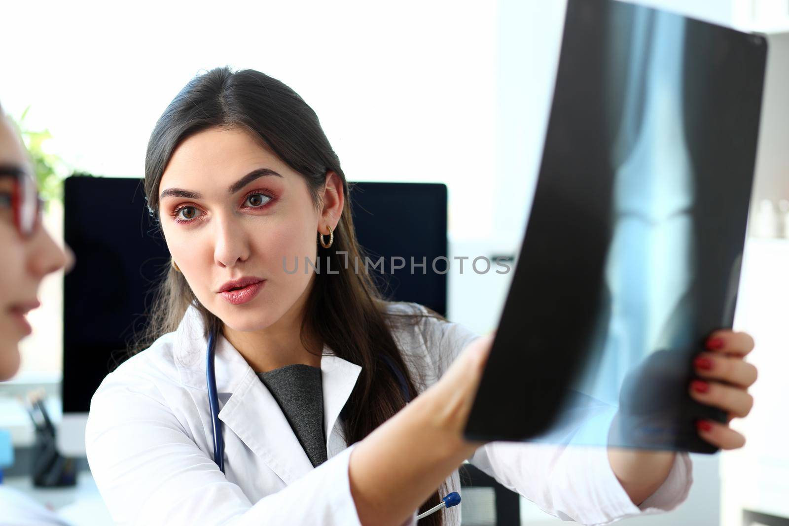 Female white doctor hold in arm and look by kuprevich