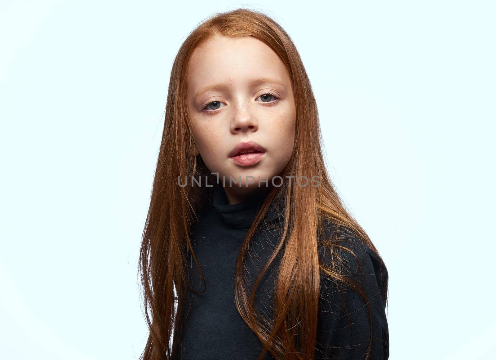 red-haired girl in a black sweater planning close-up by Vichizh