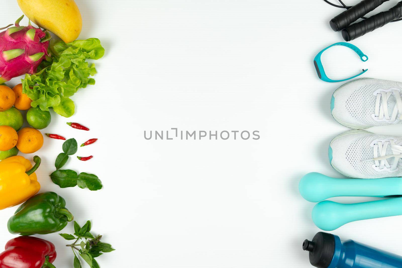 Healthy lifestyle, food and sport concept. athlete's equipment and fresh fruit on white background. by psodaz