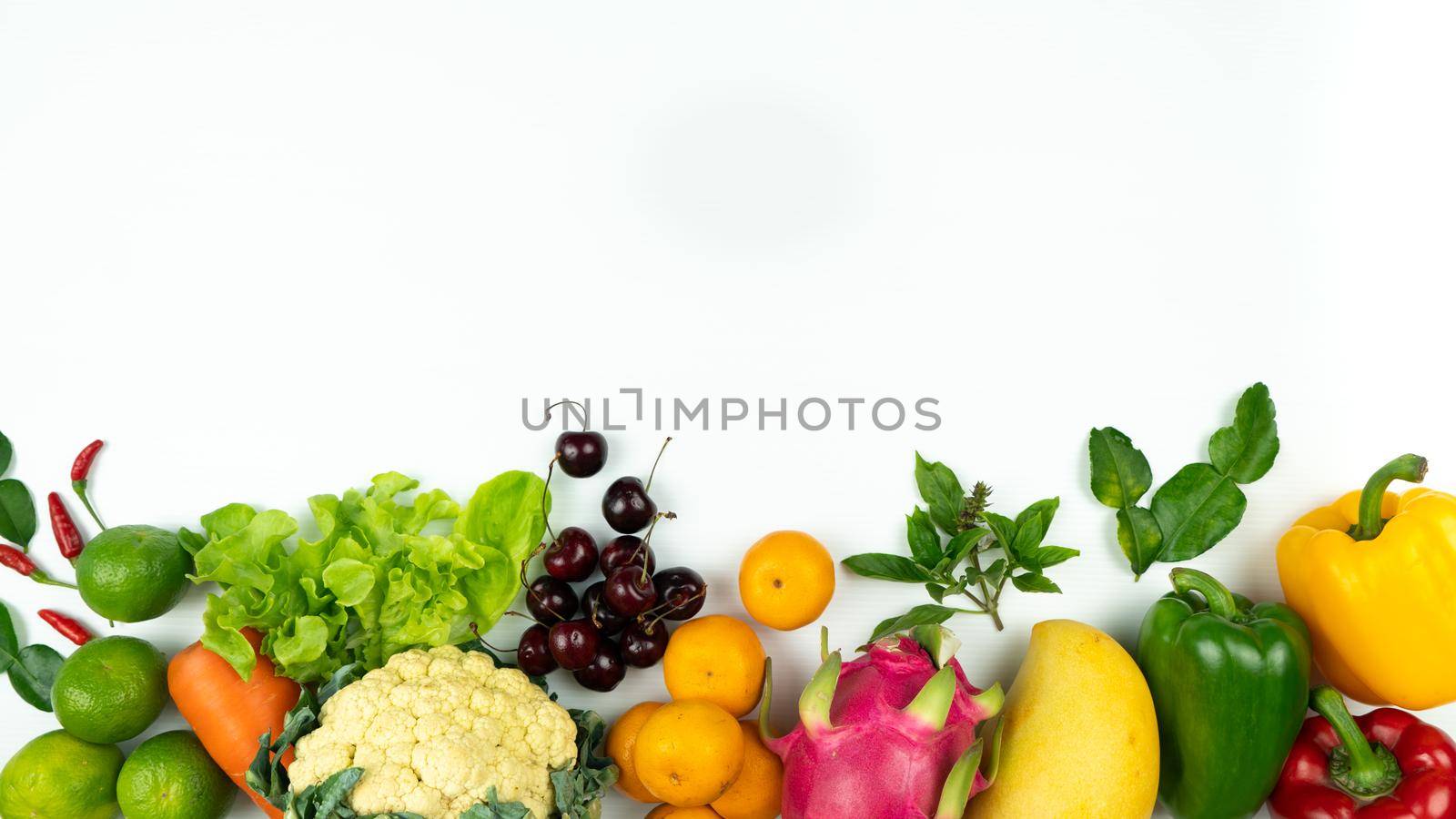 Fresh fruit and vegetable. Flat lay of fresh raw organic vegetables on white background by psodaz