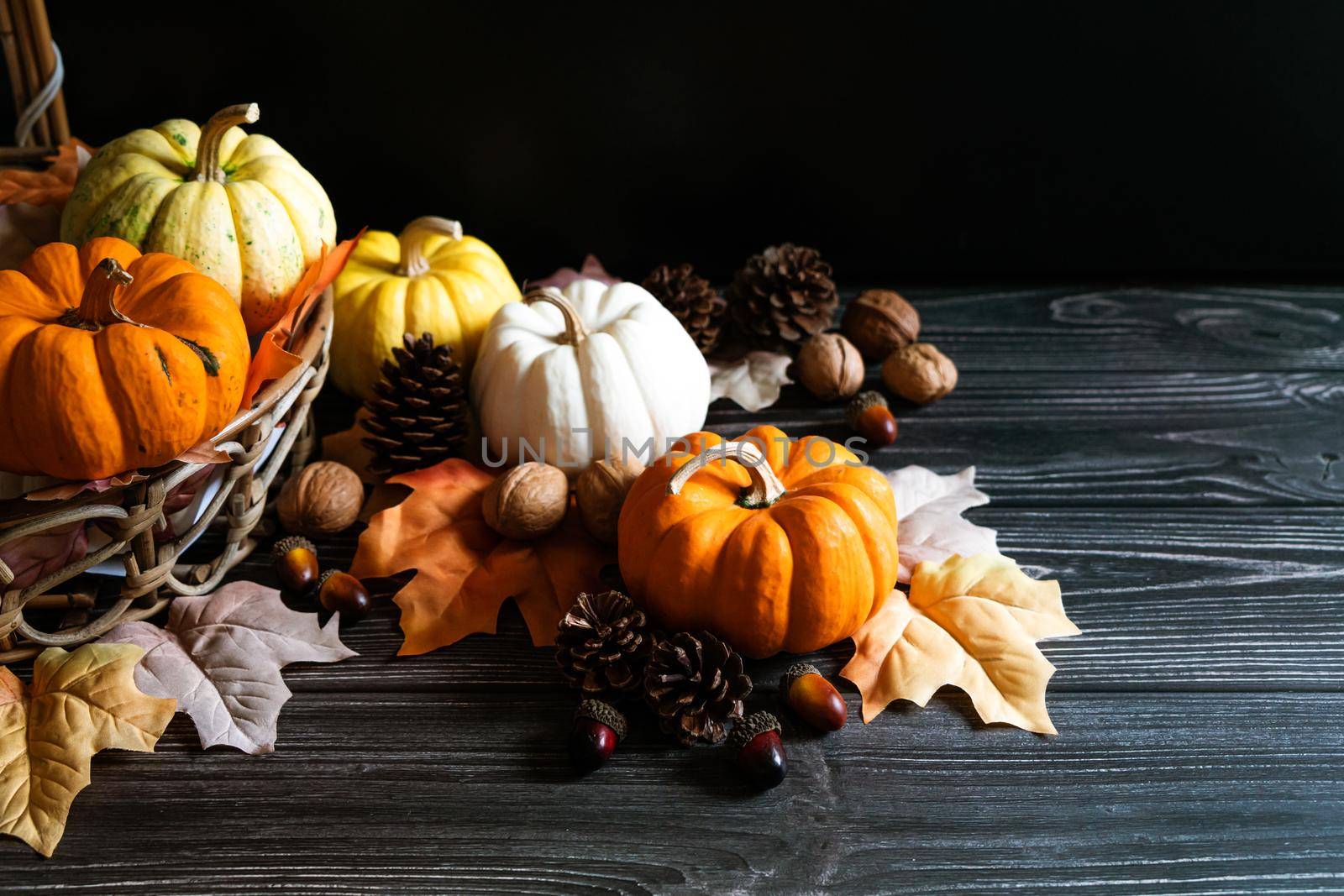 Happy Thanksgiving Day with pumpkin and nut on wooden table