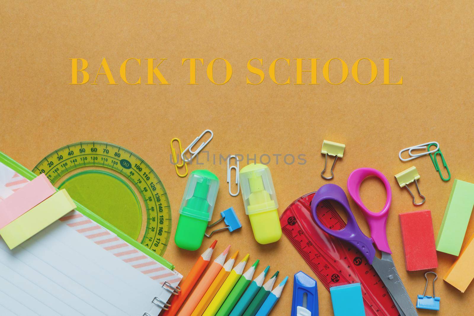 School supplies on black board background. Back to school concept