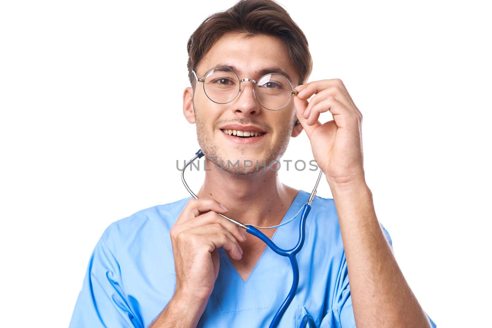 man in medical uniform wearing glasses stethoscope posing isolated background. High quality photo