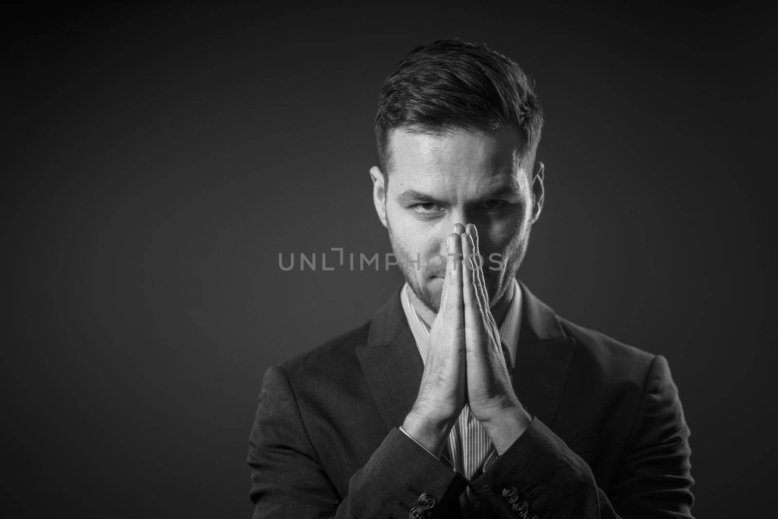 Decision-making. A White-collar Businessman Decides How to Develop the Business. Crisis Concept. Black and White Portrait. High quality photo