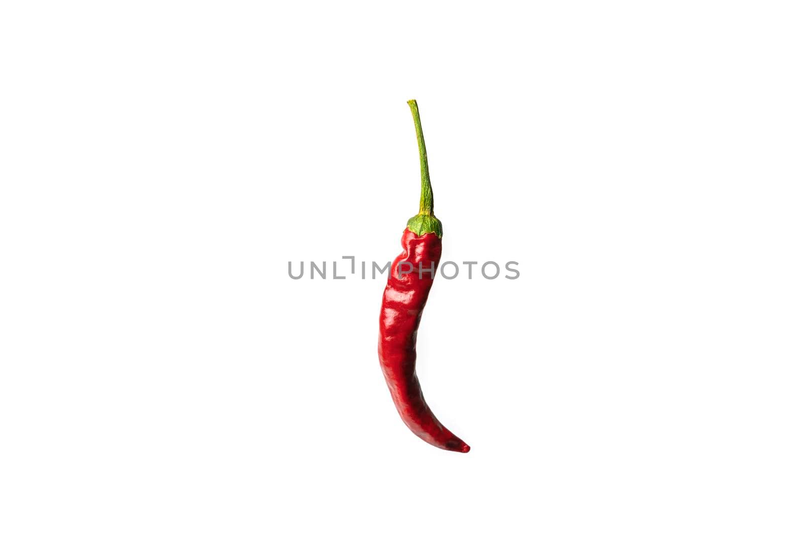 red hot pepper on a white background with a hard shadow. High quality photo