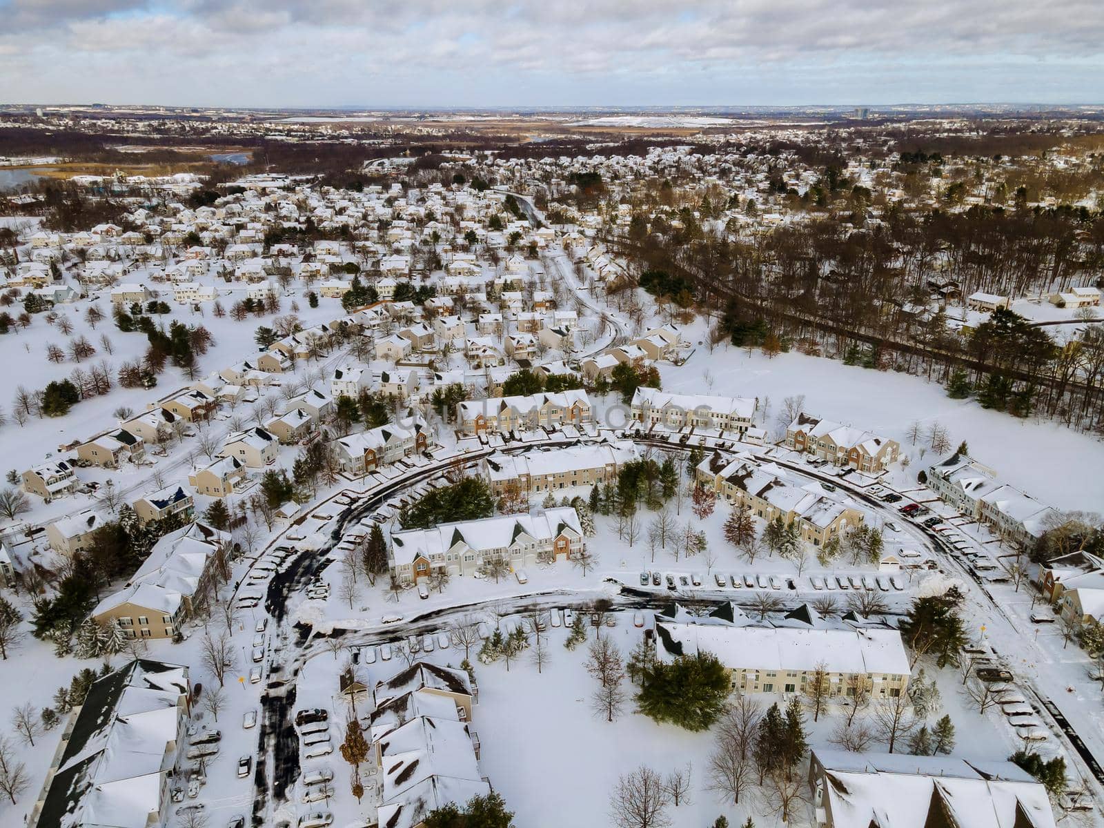 Aerial view winter landscape American town small home complex of a snowy winter on the streets after snowfall by ungvar