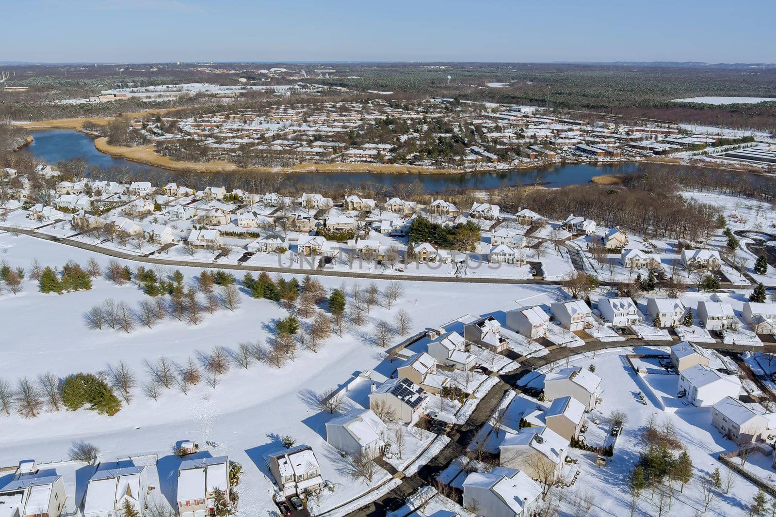 Aerial top view of winter landscape American town small home complex a snowy winter on streets after snowfall