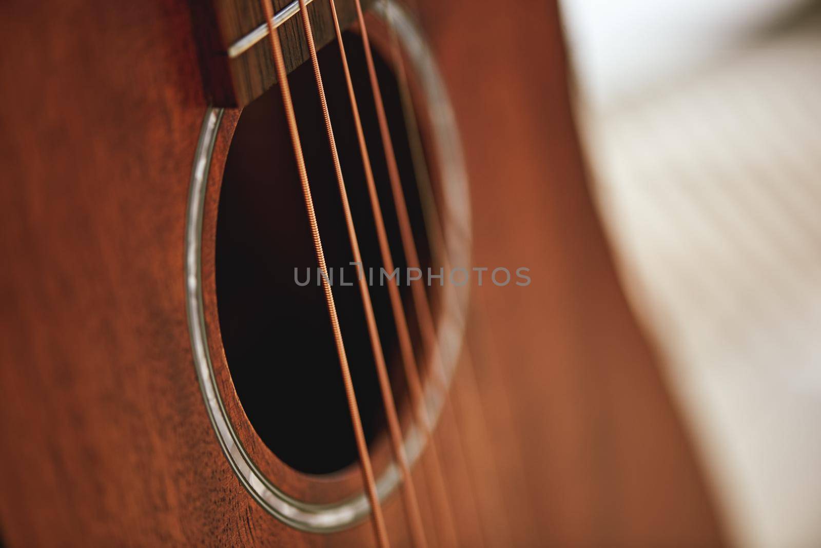 Get to know your instrument. Close up photo of acoustic guitar sound hole. Music equipment. Musical instruments. Music concept