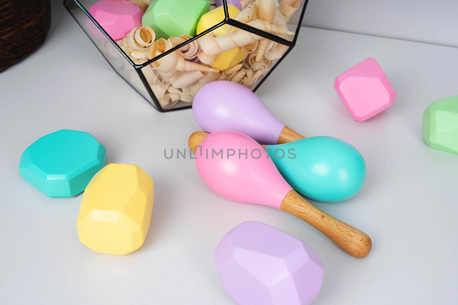 Children's wooden maracas and cubes of different colors and shapes. Eco-friendly toys for kids. Japanese game Tumi ishi. Baby maracas.