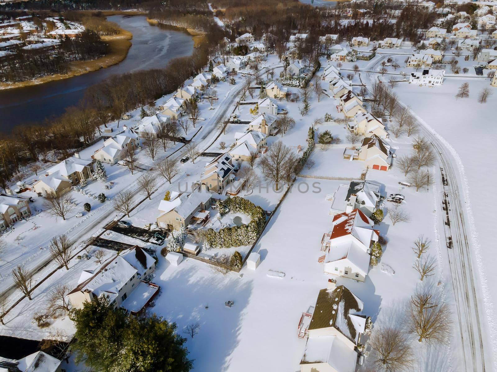 Aerial top view of landscape small town with homecomplex covered in the wonderful winter scenery white snow