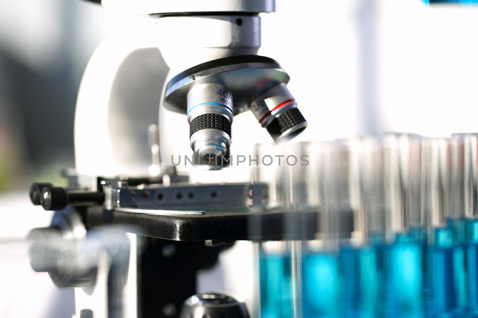 Head microscope on the background laboratory is a study human biology analyzes for non-compliance with the requirements organization public health at international level