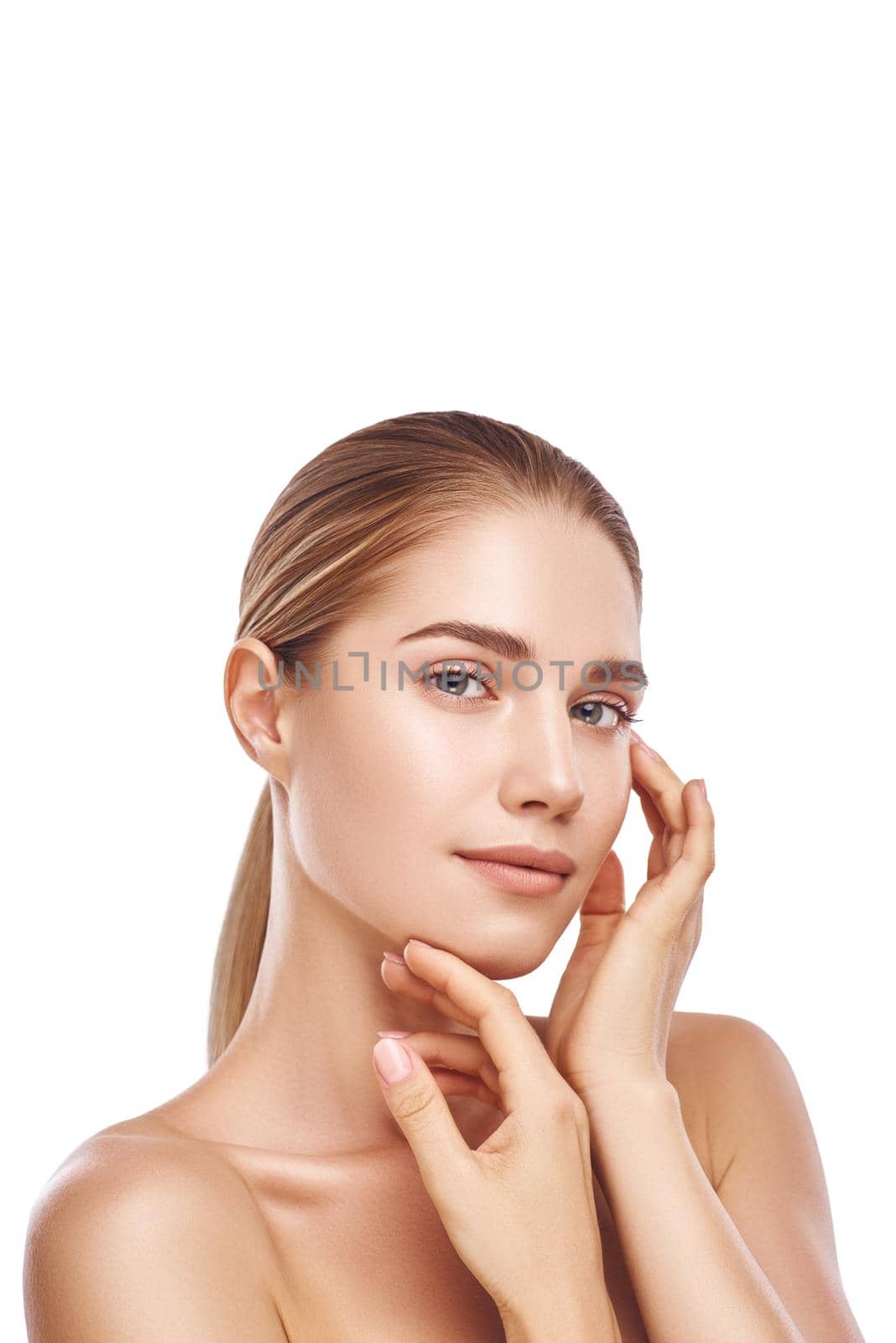 Beautiful woman face with hands close-up studio photo on white background. Light hair, grey eyes