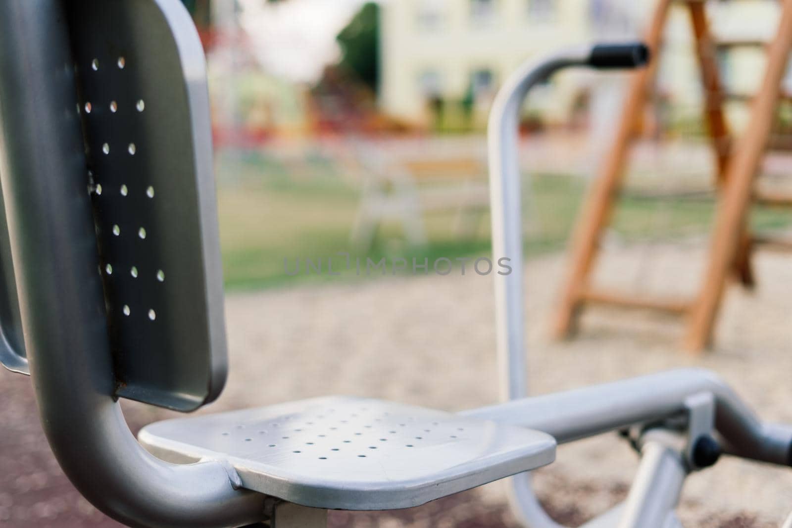 Exercise tools in the public park. Family and relax time on holiday concept. by Zelenin