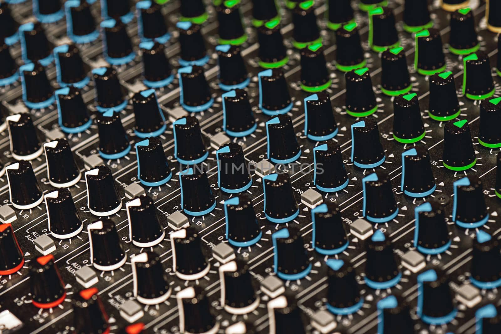 Professional Sound Mixer. Close-up view of colorful control buttons for sound adjusting in a recording studio. Sound equipment. Music record service