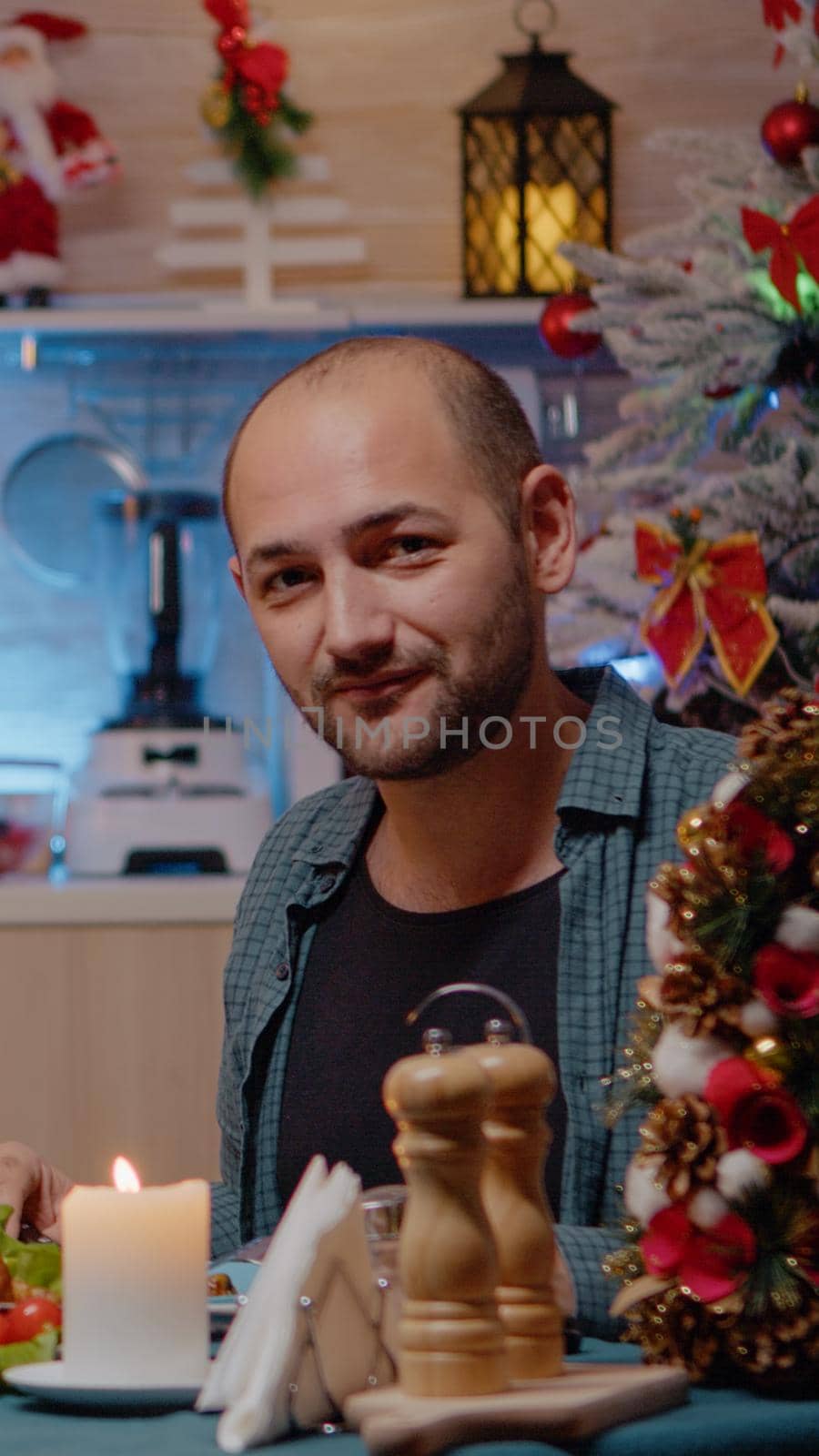 Couple talking on video call conference enjoying festive dinner by DCStudio