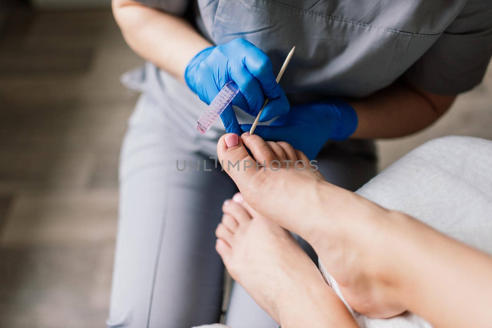 Photo of the professional pedicure process with model