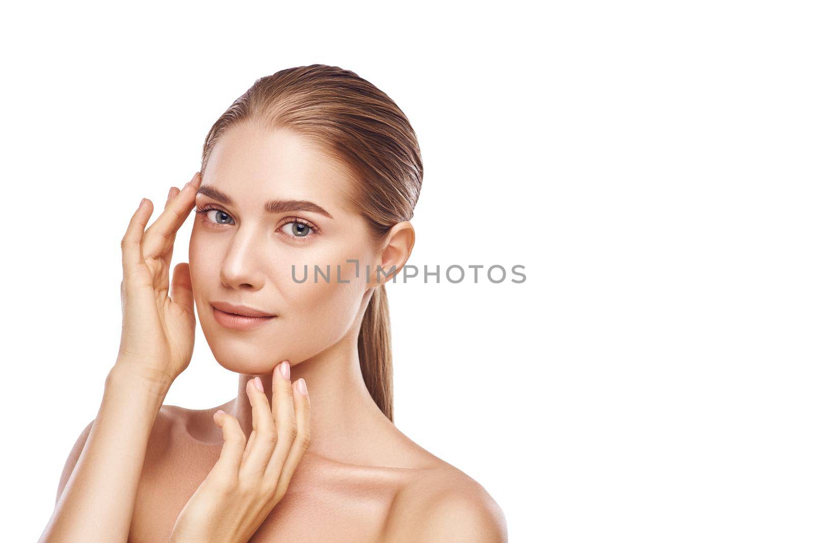 Beautiful woman face with hands close-up studio photo on white background. Light hair, grey eyes