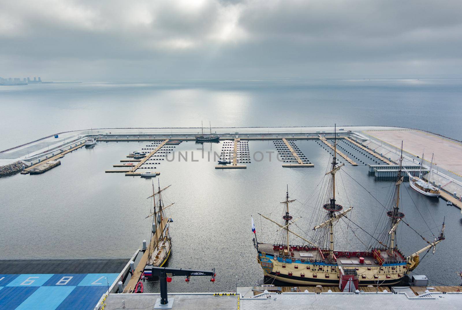 Russia, St. Petersburg, 14 October 2021: Aerial view of the new port Hercules with a replica of the old military frigate Poltava, the port next to the Lakhta center skyscraper. High quality photo