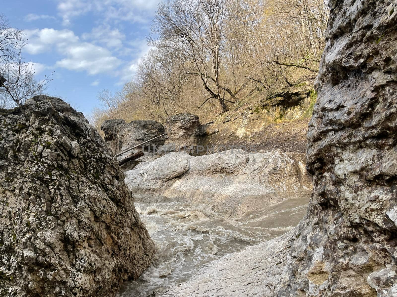 Beautiful landscape of mountain river in amazing and mysterious nature. Mountain waterway flowing through mountainous terrain. by epidemiks