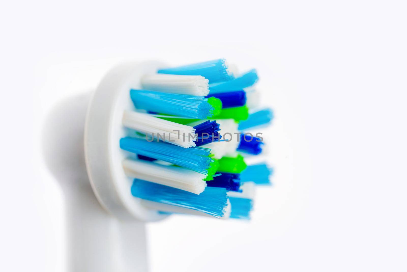 Close up of electric toothbrush on white background. Head of toothbrush for oral hygiene. Dental concept of healthy and clean teeth
