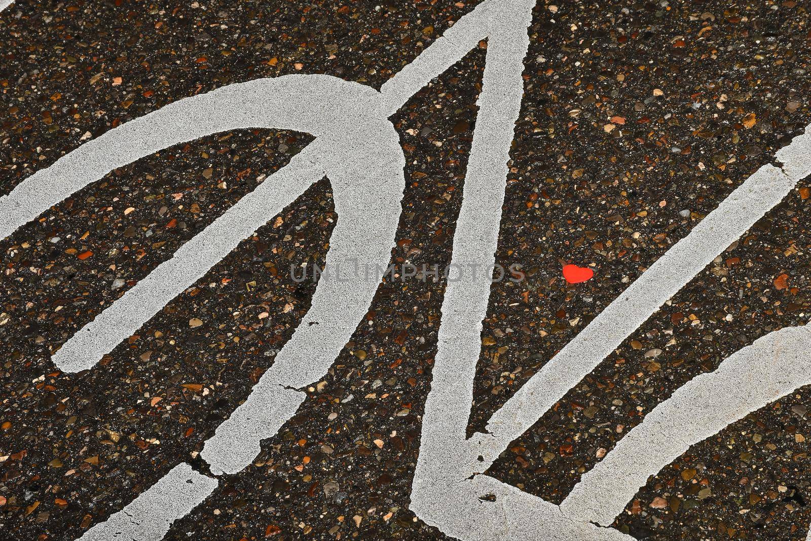 Heart on a street in a sign of a bicycle path by Jochen