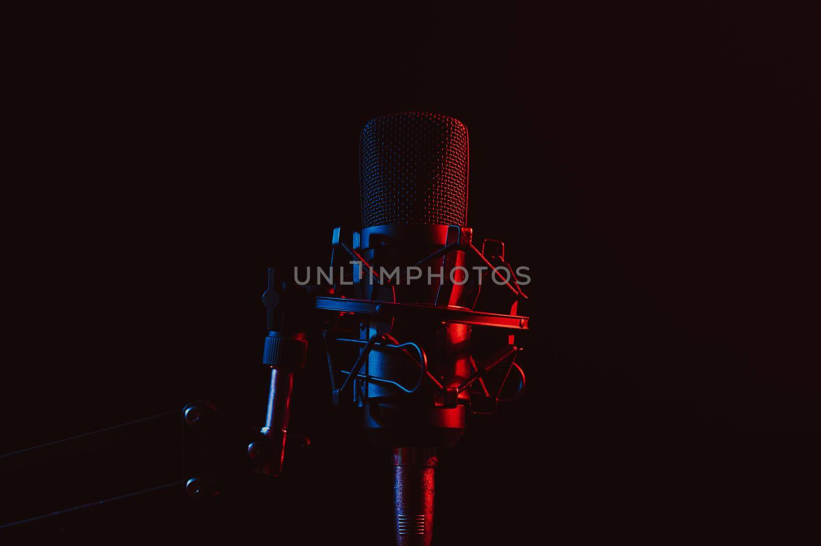 Professional microphone in pink smoke on a black background