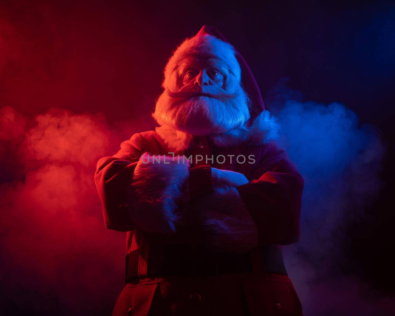 Santa claus in blue red smoke. Party for Christmas. by mrwed54