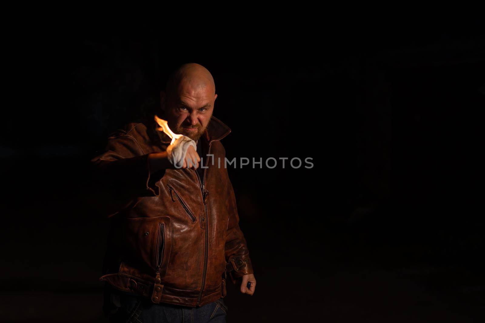 Bald Caucasian man beats with a burning fist. by mrwed54