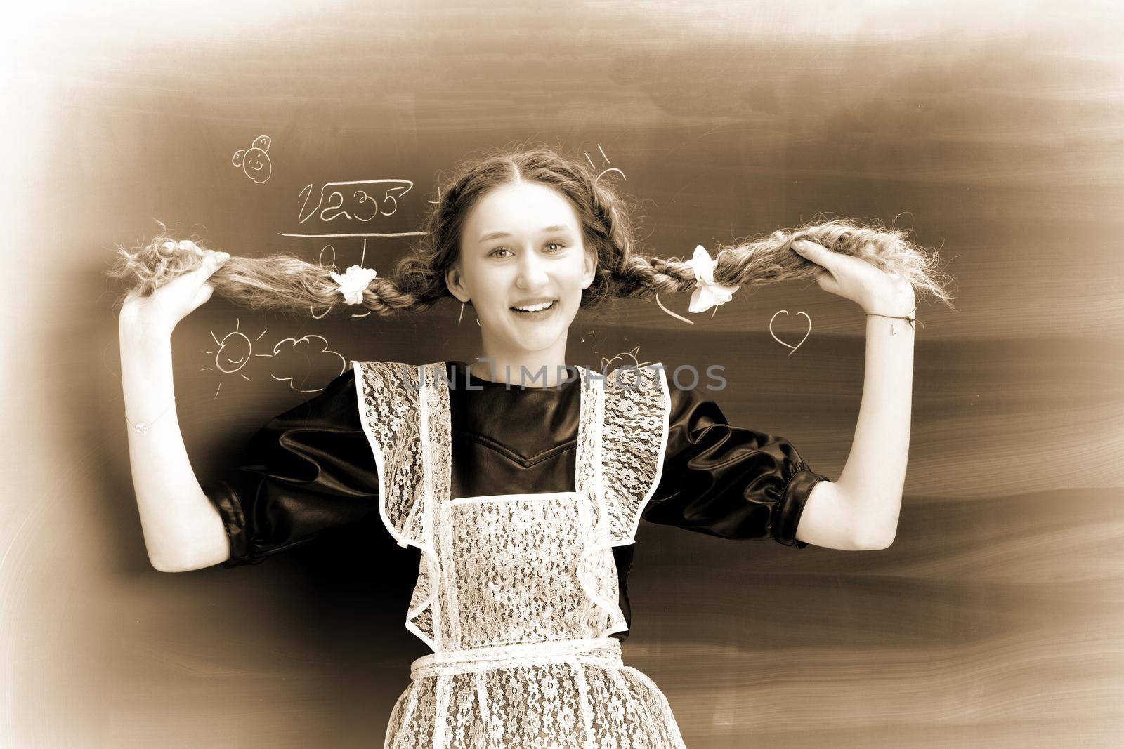 Retro shot of joyful school girl in uniform by kolesnikov_studio