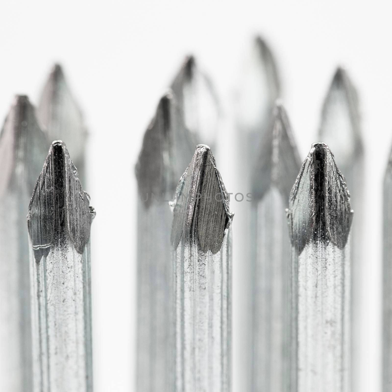 New concrete nails on a white background by titipong