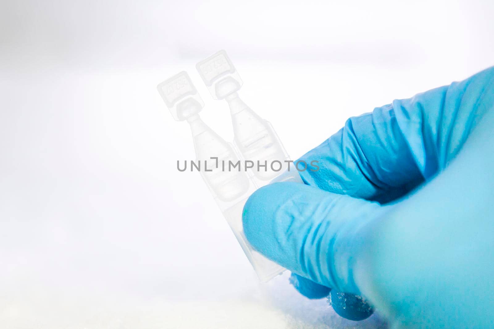a bottle of vaccine on a white background by titipong
