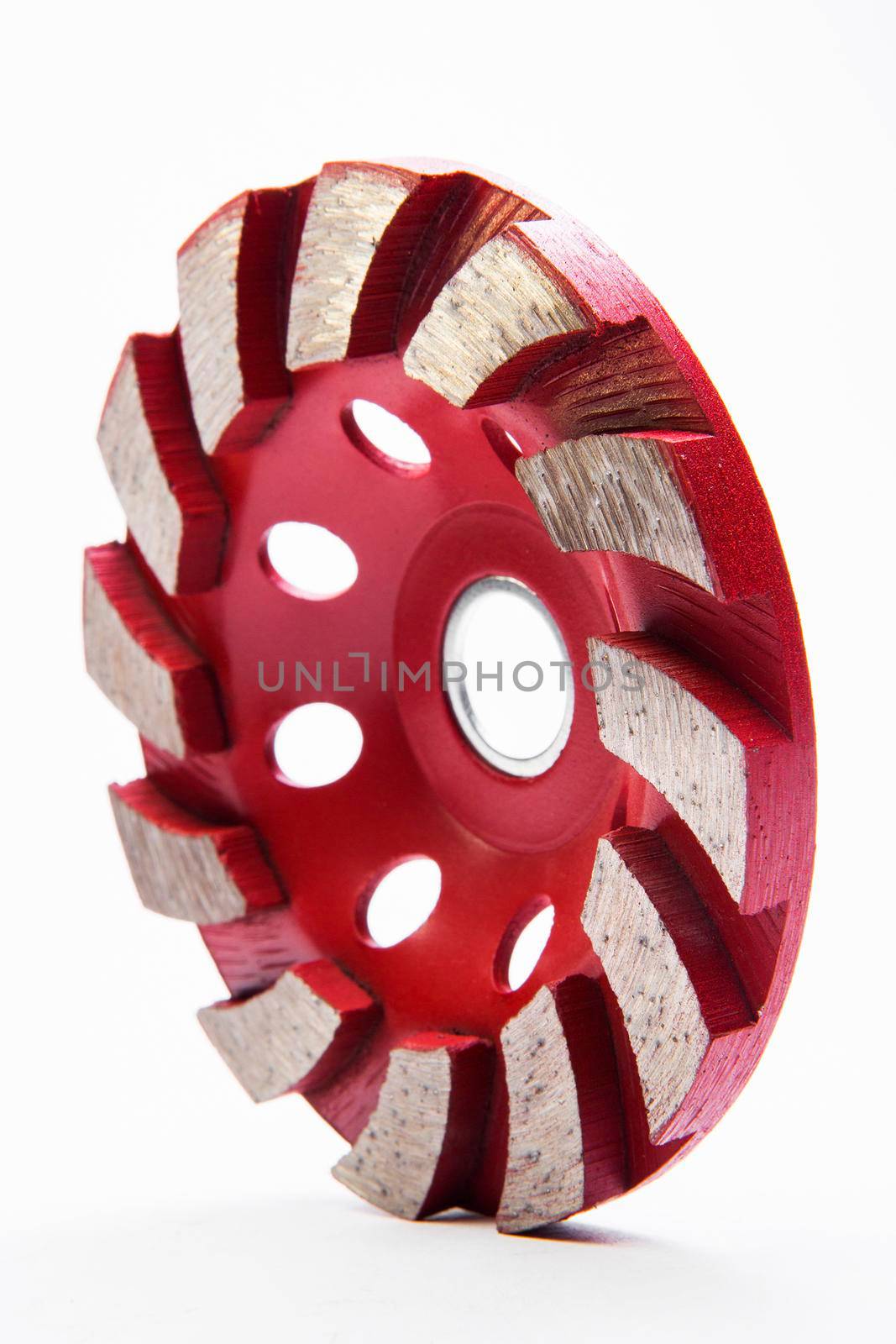Red grinding wheel on white background by titipong