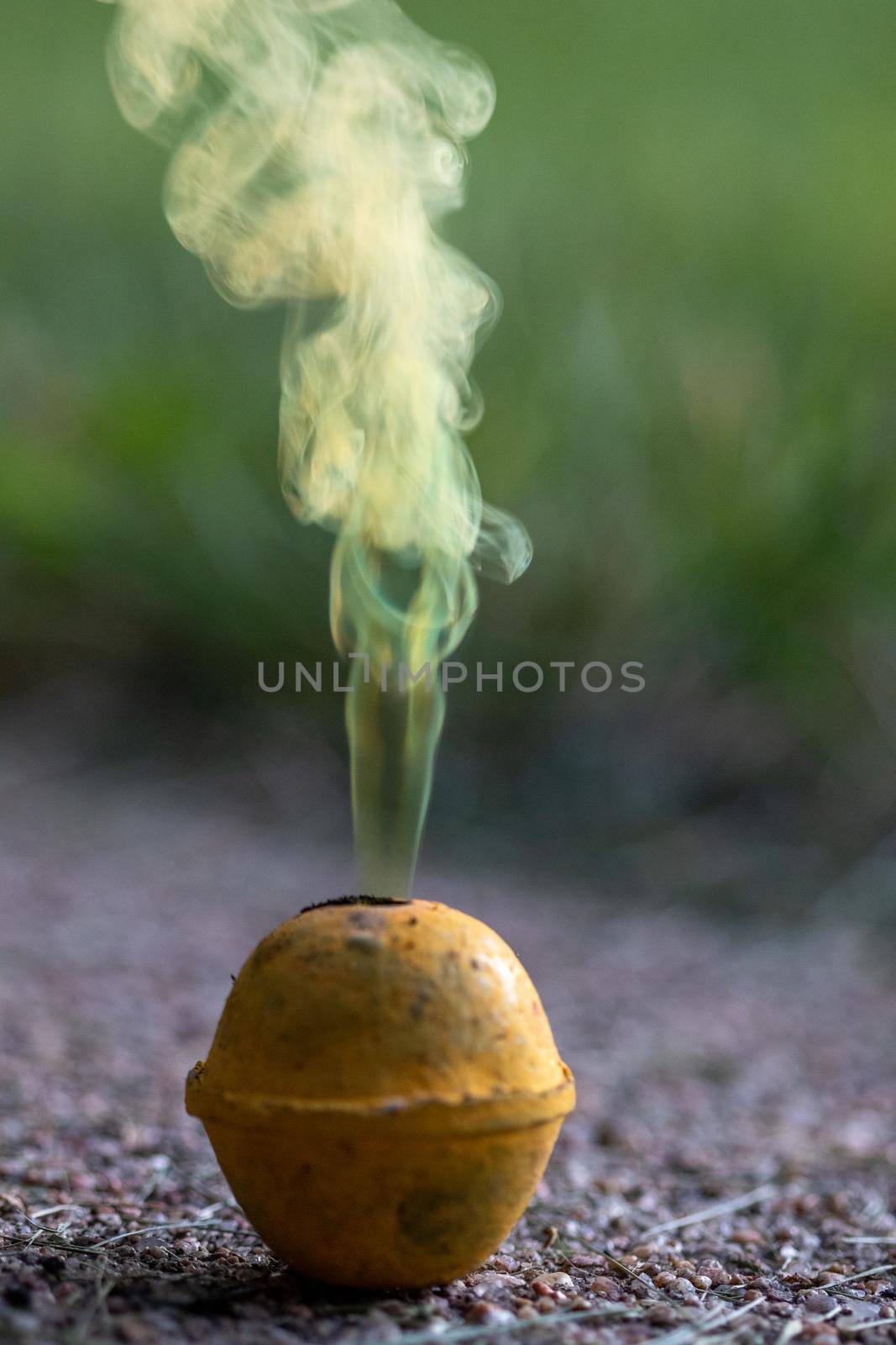 Vibrant colorful display of yellow smoke bombs celebrating independence day with textured background 4th of July . Shows artistic use of color and design. by gena_wells