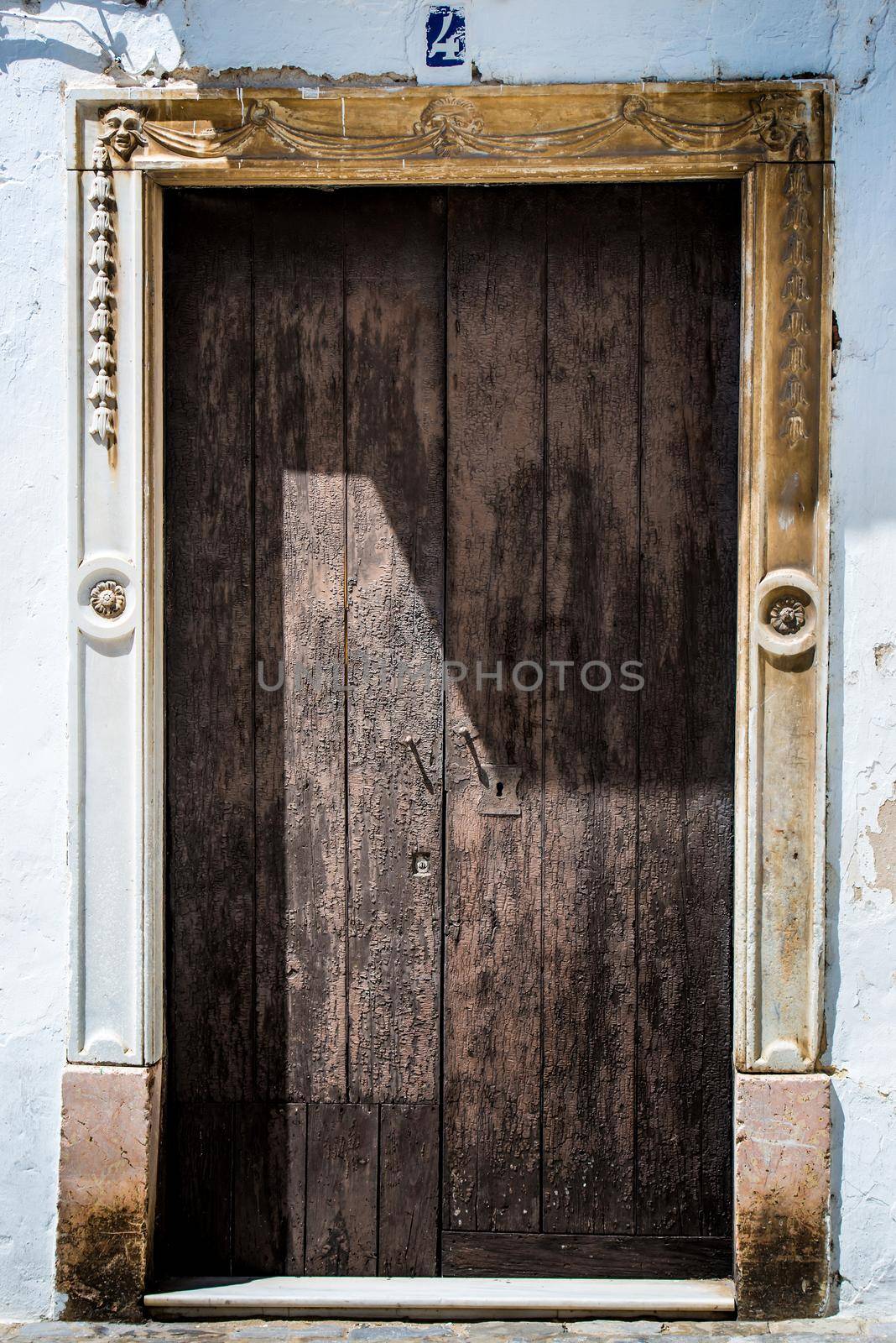 Old wooden door with shadow