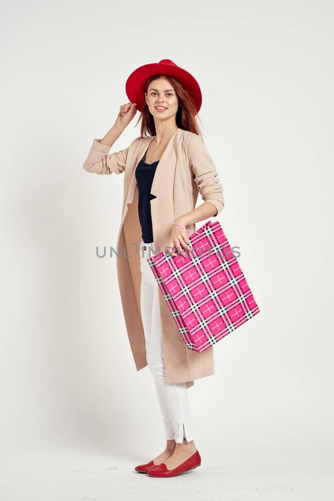 pretty woman with packages in hands Shopaholic studio model. High quality photo