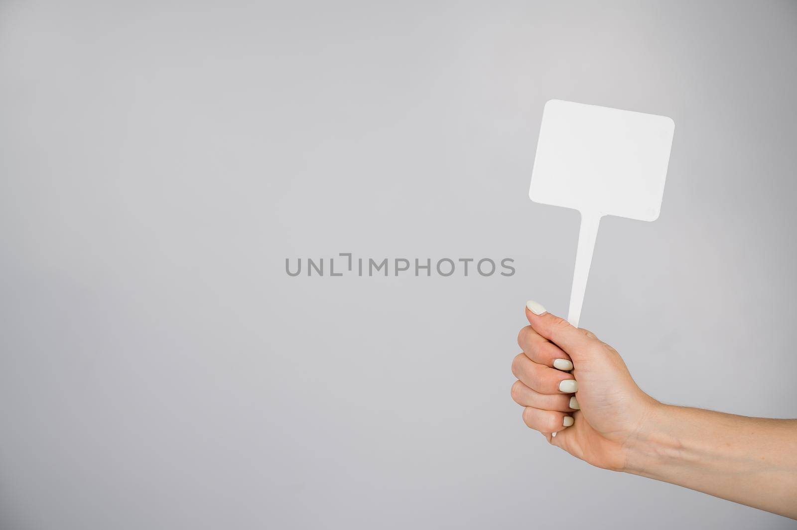 Woman holding blank sign on white background. Copy space. by mrwed54