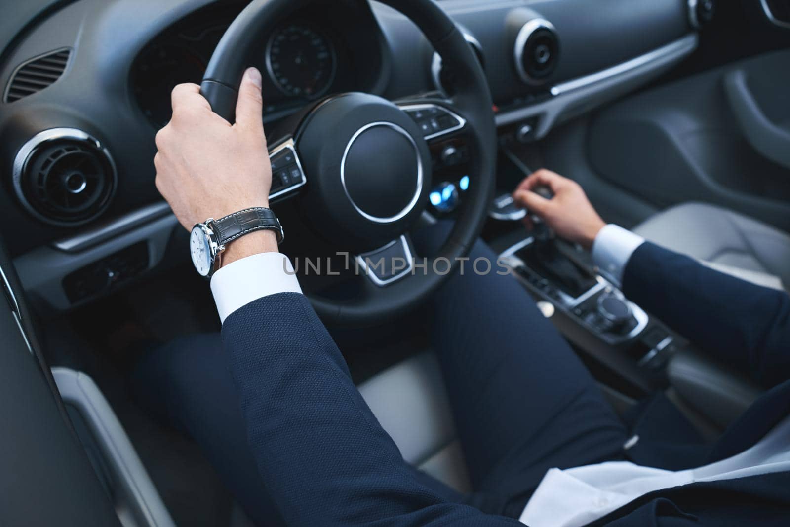 Young business man test drive new car by friendsstock