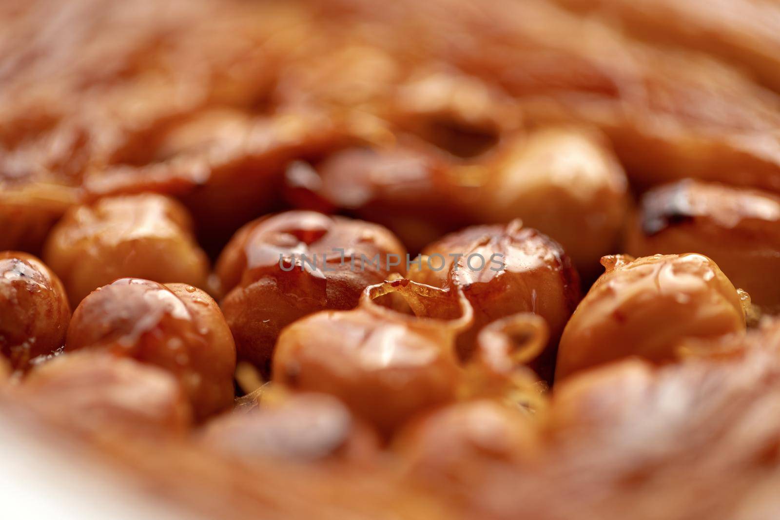 Close up photo of Turkish Baklava dessert with honey and nuts